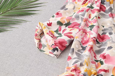 V-hals jurk met bloemenprint, plooien en pofmouwen Nexora Store