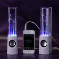 Draadloze dansende waterluidspreker met LED-lichtfontein en USB-aansluiting naast smartphone