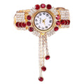 Trendy fashion quartz watch with red and clear crystals on gold bracelet band