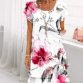 Dames jurk met korte mouwen en ronde hals in wit met roze bloemenprint