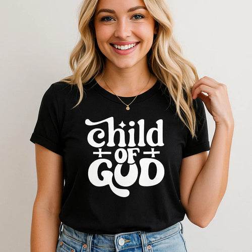 Woman wearing black Child of God T-Shirt with bold white religious typography