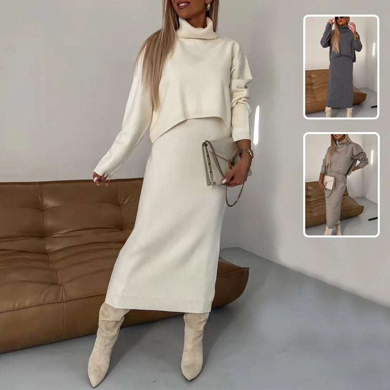 Woman wearing a white turtleneck sweater suit with long sleeveless dress and beige boots.
