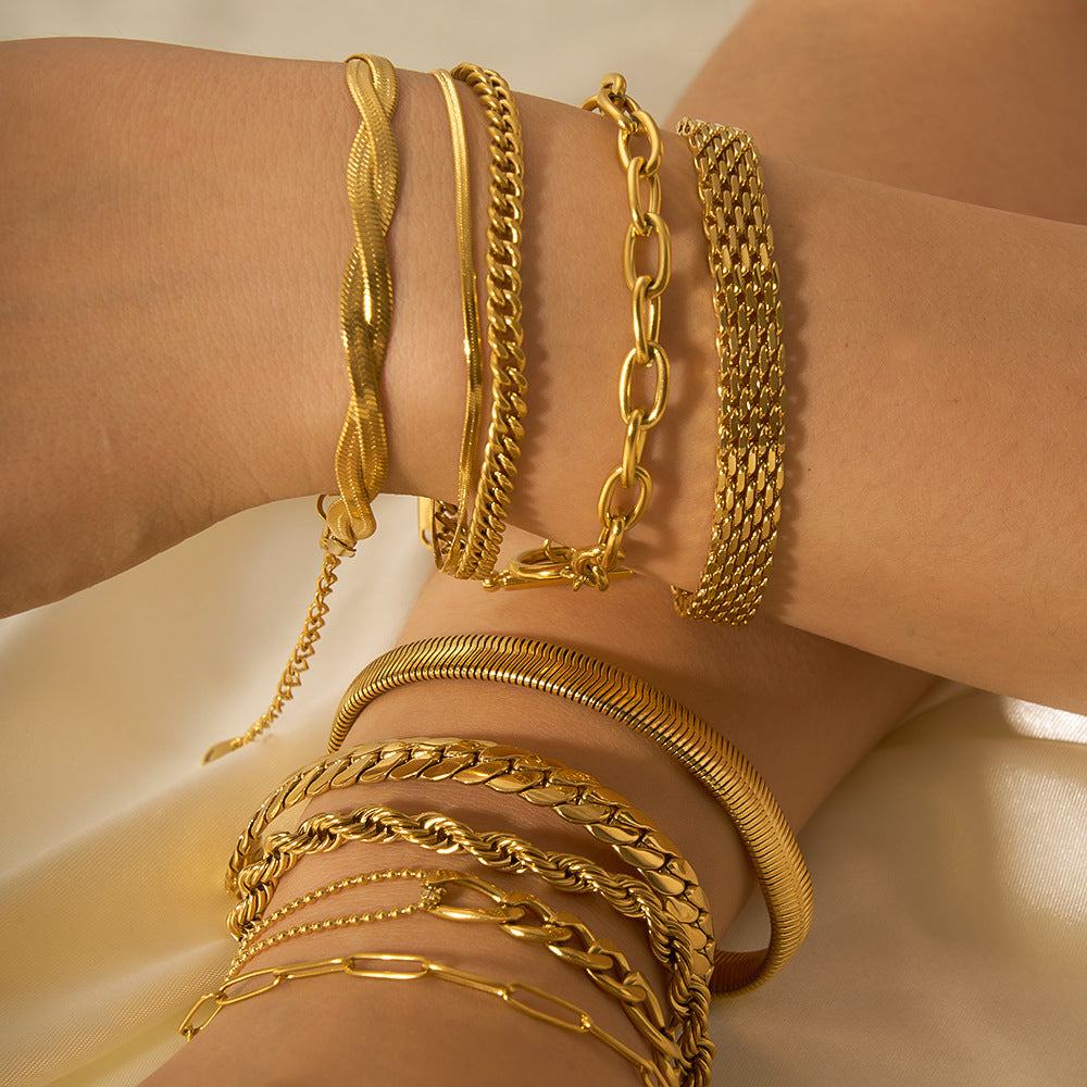 Gold-plated stainless steel ornament bracelets in various chain styles on wrists
