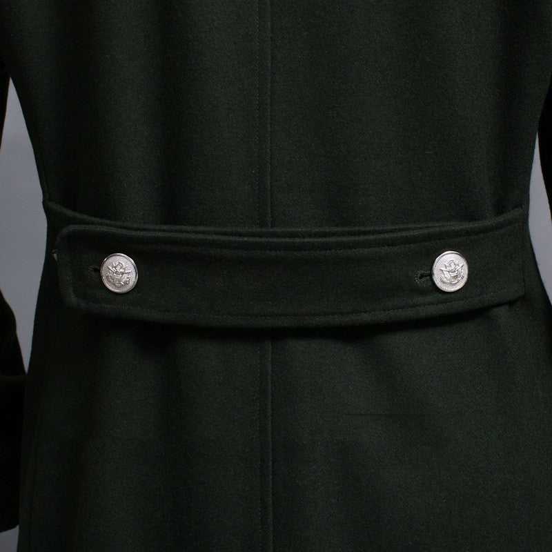 man wearing dark blue double-row retro woolen coat with silver buttons and black tie