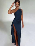 Model wearing navy blue sexy one-shoulder open back evening dress with thigh-high slit