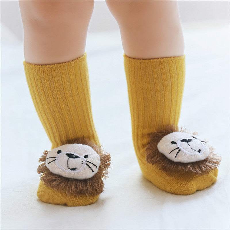 yellow baby socks with lion face design and soft mane plush on feet