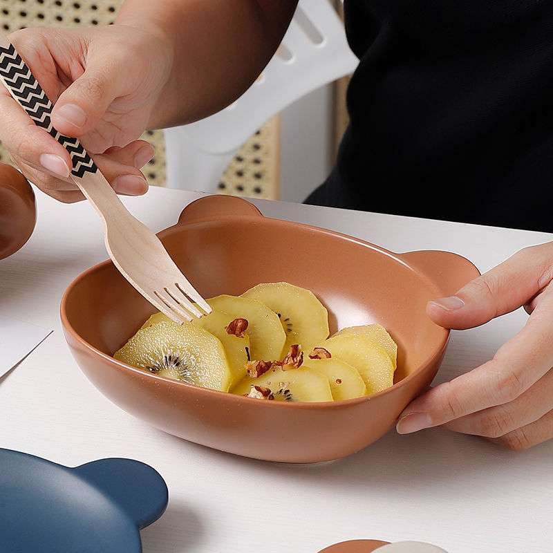Home cartoon bear-shaped porcelain dinnerware set with plates, bowls, and mugs in beige, brown, and blue colors