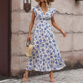 Bohemian fashion white and blue floral printed sleeveless jumpsuit with pleated skirt and V-neck