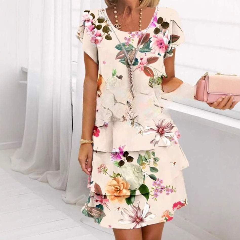 Dames jurk met korte mouwen en ronde hals in wit met roze bloemenprint