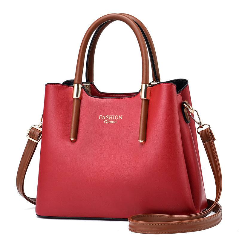 Red PU big bag with brown handles and shoulder strap, square vertical shape, zipper closure, soft surface, medium hardness, solid color handbag