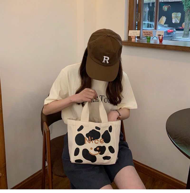 Artistieke handtas van canvas met zwart-witte print en tekst Nice, compacte vierkante vorm