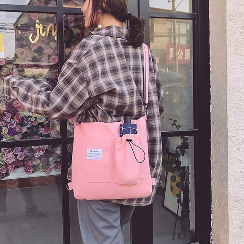 Roze Harajuku canvas tas met drie schouderbanden en letters print, stijlvol en comfortabel.