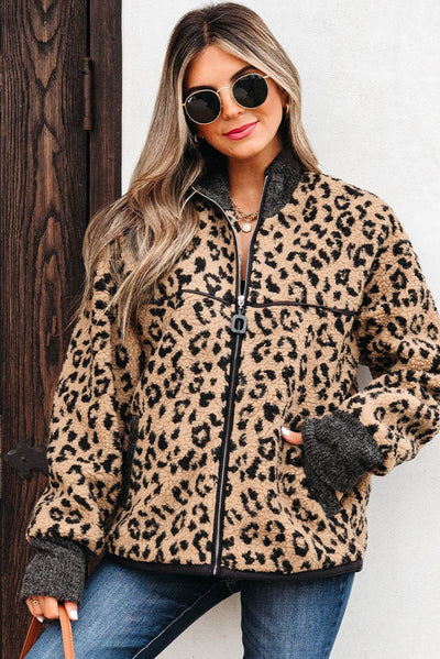 Woman wearing Sloane Leopard Zip Up fleece jacket with ribbed knit patches and front pockets